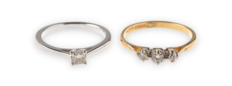 Two modern 18ct gold diamond rings of varied design, including a three stone ring,