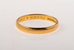 A 22ct gold wedding band, UK hallmark, size L1/2 to M, 2.0grams.