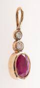 A ruby and diamond pendant, the looped bale to two collet set graduated brilliant-cut diamonds,
