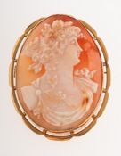 A cameo brooch, the carving depicting a lady's bust, openwork scalloped mount, marked 9ct to verso,