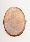 A cameo brooch, in a plain unmarked yellow metal mount, metal pin, safety chain, measuring approx.