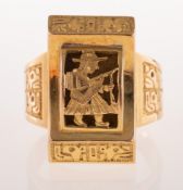 An unusual carved ring of an Asian figure in traditional dress, (possibly Chinese),