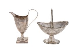 A George III cased silver cream jug, helmet-shaped, with reeded borders and engraved decoration,