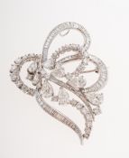 A vintage diamond foliate spray brooch, of openwork scrolling foliate design,