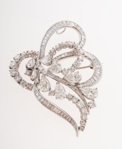 A vintage diamond foliate spray brooch, of openwork scrolling foliate design,