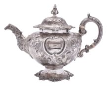A Victorian silver tea pot, circular form,