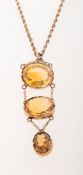 An antique citrine pendant with a rope twist chain,