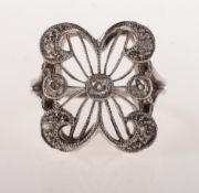 An Art Deco diamond ring, of ornate openwork scrolling design,