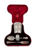 A late Victorian cased four-piece silver christening set, comprising of a beaker, napkin ring,