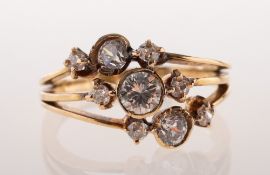 A three row diamond and paste set ring, collet set to the centre bar with a brilliant-cut diamond,