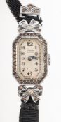 A lady's silver Art Deco cocktail watch the shaped rectangular dial having black Arabic numerals,