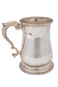 A 20th century silver mug, baluster form,