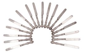 A Victorian set of seventeen silver-handled side knives, in a decorative pattern (steel blades),