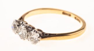 A 1940's three stone diamond ring, claw set with three old-cut diamonds, diamonds approx. 0.