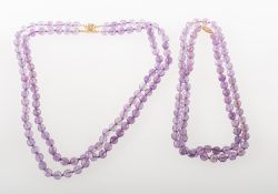 Two faceted amethyst bead necklaces of varied design,