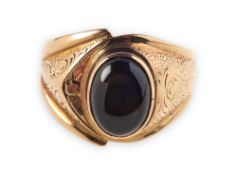 A chatoyant quartz set ring, collet and raised set with an oval chatoyant quartz cabochon,