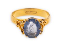 A sapphire ring, claw set with an oval mixed-cut sapphire,