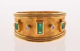 An 18ct gold emerald and diamond ring,