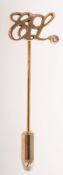 Estee Lauder, a 1980's 9ct gold diamond employee lapel pin, the initials 'EL' (Estee Lauder),