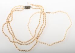 A cultured pearl necklace and a faux pearl necklace, a string of uniform knotted cultured pearls,