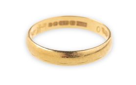 An 18ct gold wedding band, faint engraving to outside of band, UK hallmark, width approx. 3.
