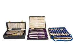 A George V cased set of six silver dessert knives, Old Danish pattern, with steel blades,
