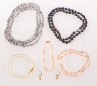 A mixed collection of pearl necklaces and a pair of earrings,