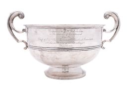 A George V silver two-handled trophy cup, circular form, with a moulded girdle and twin,