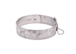 A 20th century silver bangle, with engraved decoration, by H.S Ltd, Birmingham 1967;
