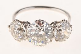 An impressive early 20th century three stone diamond ring,