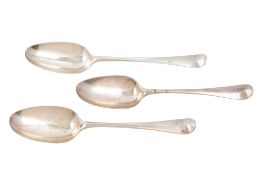 Three George III Hanoverian pattern silver tablespoons, initialled, makers marks distorted,