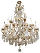 A silvered metal and cut glass twelve light chandelier, in Louis XV taste; 20th Century,