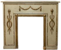 A painted and parcel gilt pine fire surround, in Neoclassical style,