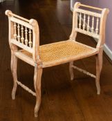 A beech and canework window seat in 18th century taste,