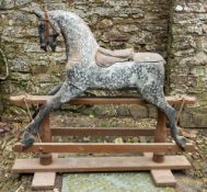 A Victorian carved and painted wood rocking horse,