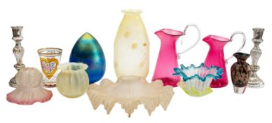 A mixed group of coloured glass including vaseline glass shades, iridescent and other glass,