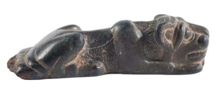 A CARVED ELAMITE STONE KNIFE HANDLE IN THE FORM OF A RECUMBENT LION, CIRCA 6TH-5TH CENTURY B.C.