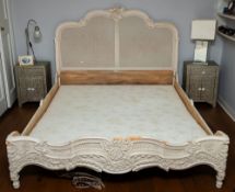 A carved and painted wood and canework double bedstead, in Louis XV taste,