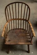 A primitive oak, ash and elm elbow chair, 19th century; with hoop and spindles back,