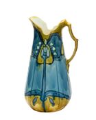 A Minton Secessionist pottery wash jug tube lined with stylised blooms, 38cm high, printed marks,
