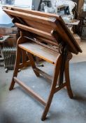 An oak, pine and wrought iron adjustable draughtsman's table, by Stanley, London,