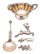 A mixed lot of silver, to include a German sauce boat, a deer brooch, a jaguar brooch,