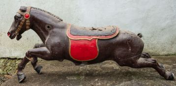 A carved and painted wood carousel horse, late 19th /early 20th century; modelled at full gallop,