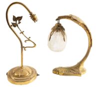 A gilt metal desk lamp, early 20th century; the arching stem modelled as an eagle,