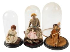An early 20th century bisque doll under glass dome, with painted face and articulated body,