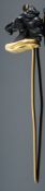 A horses head stick pin, with a black carved stone horses head, (possibly onyx),