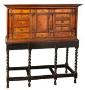 A Continental, probably Dutch walnut and burr walnut cabinet on stand, early 18th century,