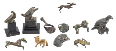 A GROUP OF THREE ROMANO-BRITISH ENAMELLED BRONZE FIBULAE AND FOUR BRONZE ANIMALS,