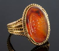 A 19th century yellow metal and agate intaglio seal ring,
