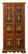 An Indian painted wood cupboard, 20th century; with moulded cornice above twin panel doors,